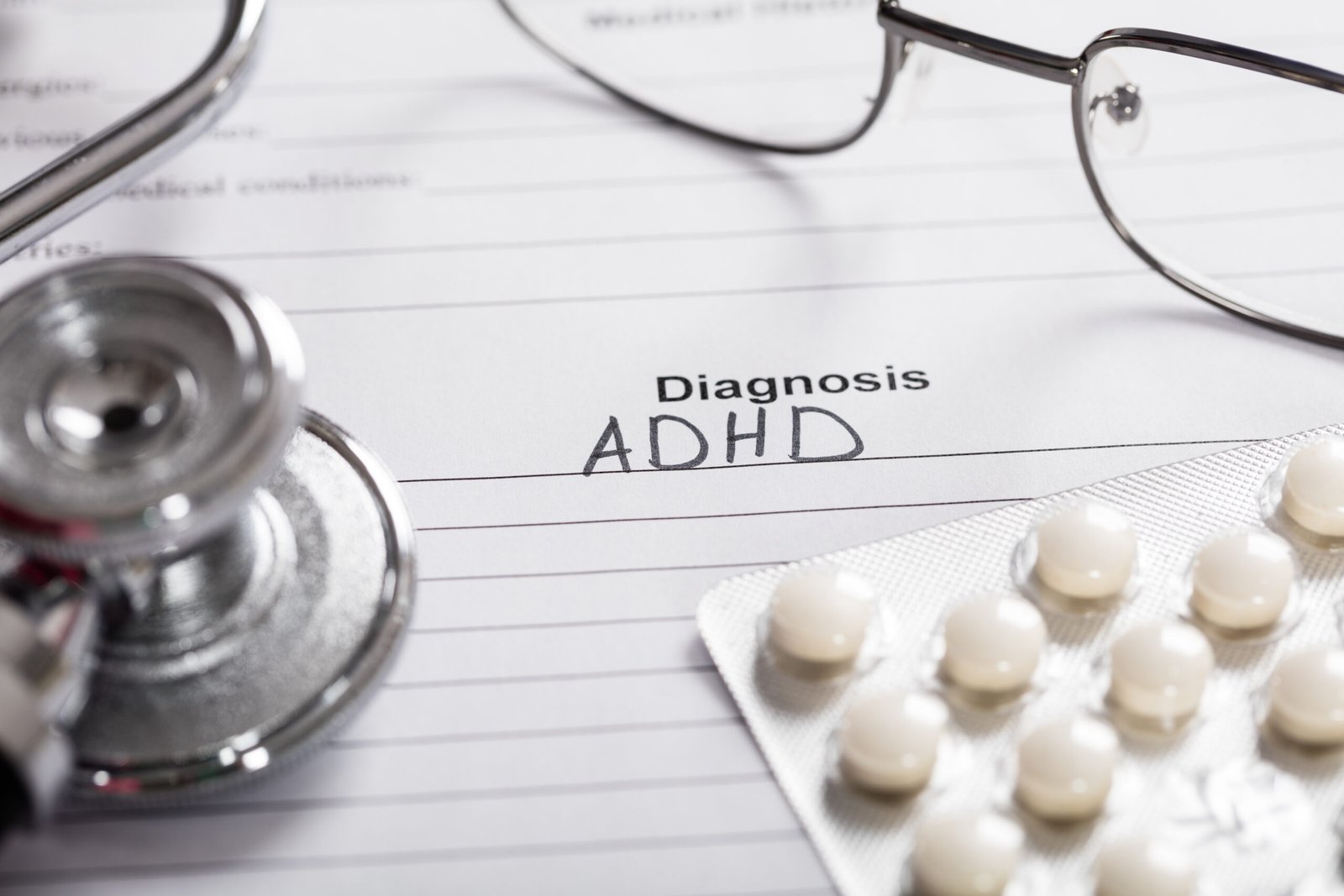 Pills;Glasses And Stethoscope With Text Diagnosis ADHD